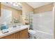 Clean bathroom with a shower/tub combo, and wood vanity at 1513 Lozano Ave, The Villages, FL 32159