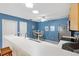 Charming eat-in kitchen area with blue walls, stainless steel appliances, and a cozy breakfast nook at 1513 Lozano Ave, The Villages, FL 32159