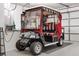 Golf cart parked in garage with ample storage at 1513 Lozano Ave, The Villages, FL 32159