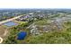 Scenic aerial view showcasing the community's proximity to nature and the surrounding wetlands and nearby highway at 15501 Markham Dr, Clermont, FL 34714