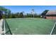 Full basketball court perfect for recreational activities and sports, with a verdant perimeter and clear blue sky at 15501 Markham Dr, Clermont, FL 34714