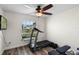 A home gym features a treadmill and weight bench, perfect for staying active at 15501 Markham Dr, Clermont, FL 34714