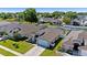 Charming home featuring a well-manicured lawn, neutral color scheme, and an attached two car garage at 15501 Markham Dr, Clermont, FL 34714