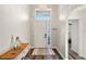 Bright foyer with high ceilings, wood-look floors, decorative chandelier, and console table at 15501 Markham Dr, Clermont, FL 34714