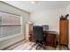 Bright home office setup with ample natural light and storage space at 15501 Markham Dr, Clermont, FL 34714