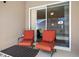 Patio space with comfortable seating and a view of the sparkling pool and screened-in enclosure at 15501 Markham Dr, Clermont, FL 34714