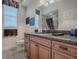 Bathroom featuring granite countertop vanity, tile flooring, and a shower with decorative curtain at 1573 Blenheim Trl, The Villages, FL 32162