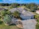 Stunning home with a three-car garage, beautiful landscaping and paver driveway situated on a lush lot at 1573 Blenheim Trl, The Villages, FL 32162