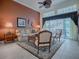 Comfortable living room with a large area rug, neutral furniture and access to outdoor patio at 1573 Blenheim Trl, The Villages, FL 32162