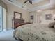 The bright main bedroom boasts crown moulding and neutral tones at 1573 Blenheim Trl, The Villages, FL 32162