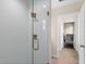 Modern bathroom glass shower with stylish bronze fixtures and door to bedroom at 2029 Stefano Ct, Mount Dora, FL 32757