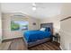 Bedroom with a tranquil lake view, offering a serene escape and modern comfort at 2029 Stefano Ct, Mount Dora, FL 32757