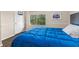 Cozy bedroom with plush bedding and view of lush greenery at 2029 Stefano Ct, Mount Dora, FL 32757