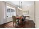 Dining room with hardwood floors, and natural light from a large window overlooking the lawn at 2029 Stefano Ct, Mount Dora, FL 32757