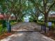 Gated waterfront community access, tree lined and offering stunning views to the lake and private dock area at 2029 Stefano Ct, Mount Dora, FL 32757