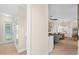 Hallway that showcases a seamless transition into a living space, offering an inviting atmosphere and stylish design at 2029 Stefano Ct, Mount Dora, FL 32757