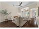 Bright living room with high ceilings, ceiling fan, and hardwood floors at 2029 Stefano Ct, Mount Dora, FL 32757