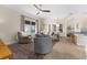 Open living area with neutral furniture, a ceiling fan, and views to the dining area and kitchen at 2029 Stefano Ct, Mount Dora, FL 32757