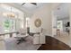 Inviting living room with hardwood floors, neutral walls, and arched doorways provides a cozy, yet open space at 2029 Stefano Ct, Mount Dora, FL 32757