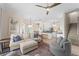 Bright, open living space with stylish furnishings and an open layout to the kitchen and dining area at 2029 Stefano Ct, Mount Dora, FL 32757