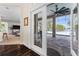 Indoor-outdoor living showcasing a door to the patio and view of screened-in pool and lake at 2029 Stefano Ct, Mount Dora, FL 32757