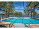 Enjoy the screened pool with its lake views and sunny skies at 2029 Stefano Ct, Mount Dora, FL 32757