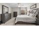 Bedroom featuring neutral paint, carpet, lots of closet space, and large windows for natural light at 2170 Biller Cir, The Villages, FL 32163