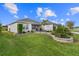 Well-maintained front yard with decorative landscaping and lush green grass at 2170 Biller Cir, The Villages, FL 32163