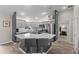Modern kitchen featuring a center island with bar stools, stainless appliances, and open access to other rooms at 2170 Biller Cir, The Villages, FL 32163