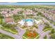 Aerial view of a clubhouse, pool, tennis courts, and other community amenities at 2310 Silver Palm Dr # 301, Kissimmee, FL 34747