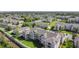 An aerial view of the condo community showcasing its layout, green spaces, and surrounding neighborhood at 2310 Silver Palm Dr # 301, Kissimmee, FL 34747