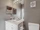 Bathroom featuring a vanity with ample counter space and a decorative mirror at 2310 Silver Palm Dr # 301, Kissimmee, FL 34747