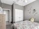 Charming bedroom with playful wall decor, plush toy, and a comfortable bed at 2310 Silver Palm Dr # 301, Kissimmee, FL 34747