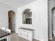 Bright dining area featuring archway view to kitchen with stainless steel appliances and stylish serving buffet at 2310 Silver Palm Dr # 301, Kissimmee, FL 34747