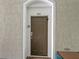 A front door of unit 301 on a well-maintained facade, with a secure entry system at 2310 Silver Palm Dr # 301, Kissimmee, FL 34747