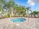 Inviting hot tub surrounded by brick pavers and lounge chairs, perfect for relaxation and enjoying the Florida sunshine at 2310 Silver Palm Dr # 301, Kissimmee, FL 34747