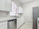 Kitchen featuring stainless steel appliances and white cabinets and countertops at 2310 Silver Palm Dr # 301, Kissimmee, FL 34747