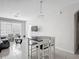 Bright living room with tiled floors, modern furnishings, and natural light at 2310 Silver Palm Dr # 301, Kissimmee, FL 34747