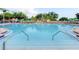 Large swimming pool with lounge chairs, umbrellas, and well-maintained surroundings at 2310 Silver Palm Dr # 301, Kissimmee, FL 34747