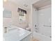 Clean bathroom with white vanity, shower and tub combination at 2461 Merida Cir, The Villages, FL 32162