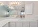 Bathroom features a bright, airy design and large white marble countertop at 2461 Merida Cir, The Villages, FL 32162