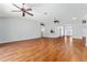 Expansive living room with hardwood floors, high ceilings, modern lighting, and seamless flow at 2461 Merida Cir, The Villages, FL 32162
