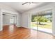 This living room boasts hardwood floors and sliding doors that open to the outdoors at 2461 Merida Cir, The Villages, FL 32162