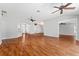 Spacious living room featuring hardwood floors and a modern ceiling fan at 2461 Merida Cir, The Villages, FL 32162