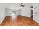 The bright and airy living room showcases hardwood floors, sliding glass doors, and modern ceiling fans at 2461 Merida Cir, The Villages, FL 32162