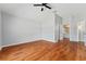 Main bedroom suite featuring hardwood floors and ensuite bathroom at 2461 Merida Cir, The Villages, FL 32162