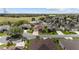 Aerial view of a well-maintained home in a desirable community with lush green surroundings and mature landscaping at 278 Matisse Ave, The Villages, FL 32162