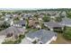 Aerial view showcasing a home in a well-maintained neighborhood with lush landscaping and verdant surroundings at 278 Matisse Ave, The Villages, FL 32162