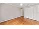 Bedroom features hardwood floors, a ceiling fan, closet and a door at 278 Matisse Ave, The Villages, FL 32162