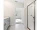 Bright bathroom features a tiled walk-in shower and a stylish gray vanity at 28078 Poppy Ct, Leesburg, FL 34748
